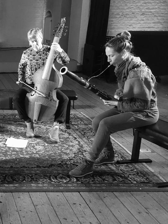 Anna-Kaisa Meklin with her viola da gamba and Sandra Weiss with her bassoon: black-and-white photo of Forbidden Color musicians performing